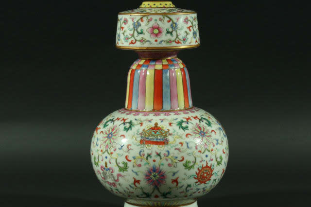 Auctioneers were left stunned when this Chinese vase valued at Â£1,200 was sold for a staggering Â£307,000 - despite possibly being a COPY. See SWNS story SWVASE; The Chinese Tibetan style temple vase is enamelled with scrolling flowers and the Eight Buddhist Treasures on a white ground. But while it looks like a vase from the Jiaqing period, 1796-1820, the 26.5cm high vase is believed to have been made in the early 20th century known as the Republic period. It was initially bought by a British solicitor when he was working in Shanghai around 100 years ago.