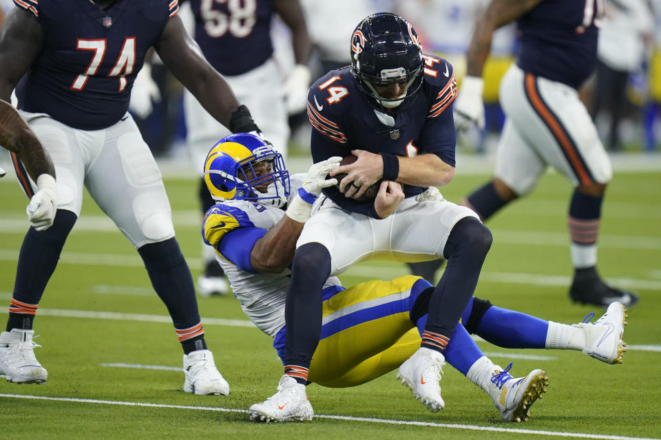 Chicago Bears quarterback Andy Dalton is hauled down by Los Angeles Rams defensive end Aaron Donald during the second half of an NFL football game Sunday, Sept. 12, 2021, in Inglewood, Calif. (AP Photo/Jae C. Hong)