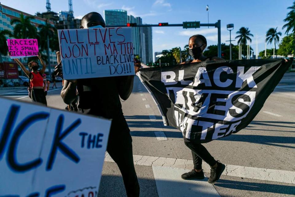 Activists participate in a Black Lives Matter protest in downtown Miami near Bayside on Saturday against the shooting of Jacob Blake in Kenosha, Wisconsin.