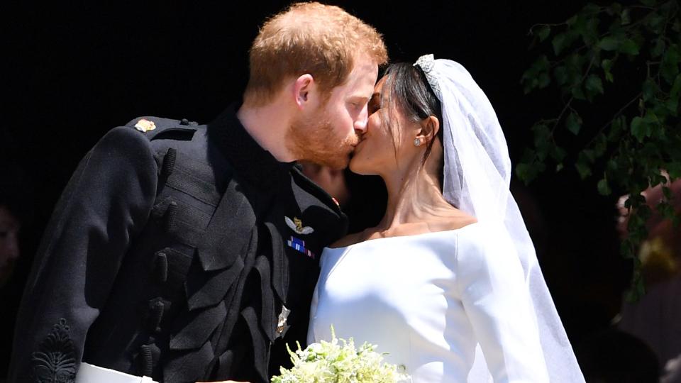 Newlyweds Prince Harry and Meghan Markle kiss following their wedding ceremony