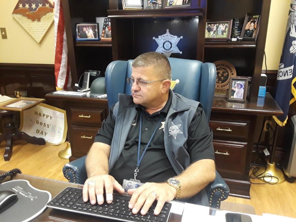 Terrebonne Sheriff Tim Soignet works at his desk Tuesday.