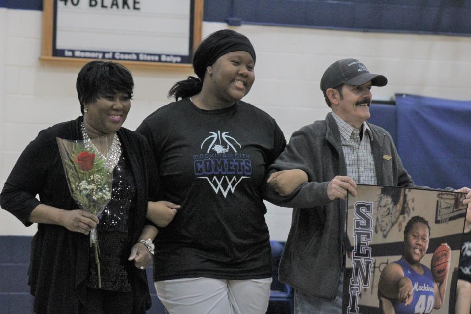 Alongside her parents, Mackinaw City's Carla Blake was one of five senior players to be honored during a ceremony before Wednesday night's game against Engadine.