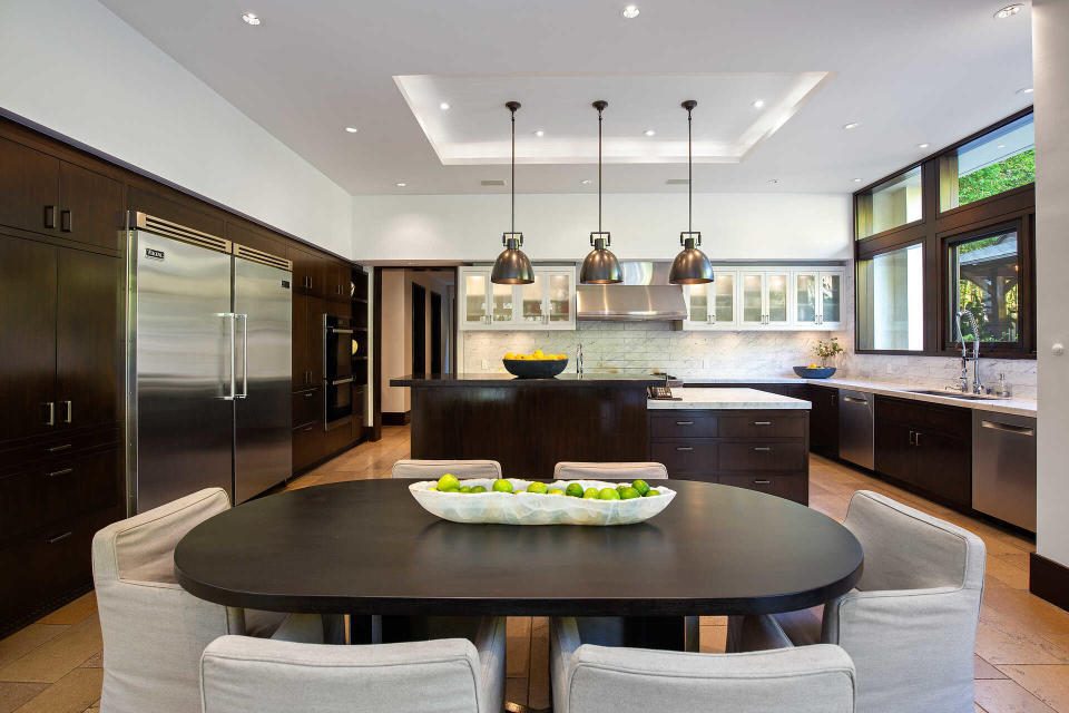 The kitchen features custom mahogany cabinetry.