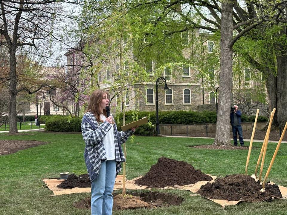 Grace Wills, president of EcoAction, addresses the students, staff and community members who gathered to watch the replanting of Old Willow. Keely Doll/kdoll@centredaily.com