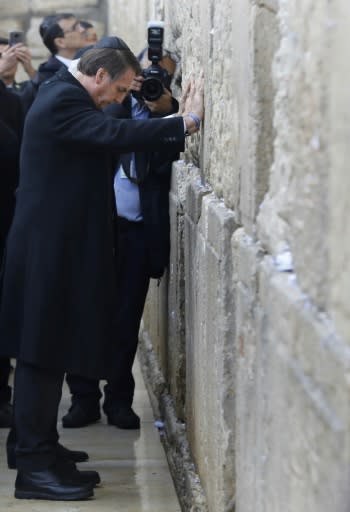 Brazilian President Jair Bolsonaro (foreground) and Israeli Prime Minister Benjamin Netanyahu (background) pray at the Western Wall on April 1, 2019