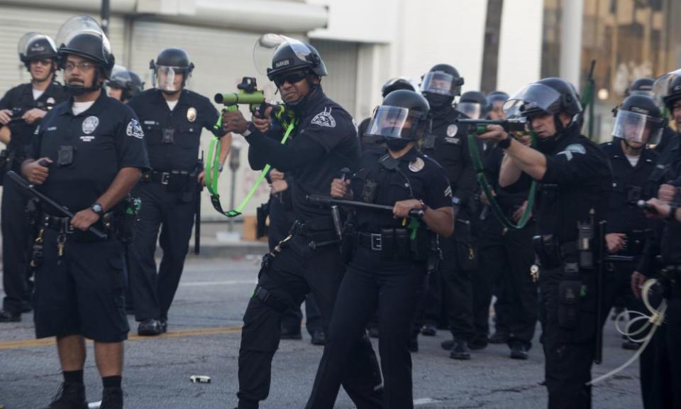 Los Angeles police officers fire rubber bullets during a protest on 30 May 2020.