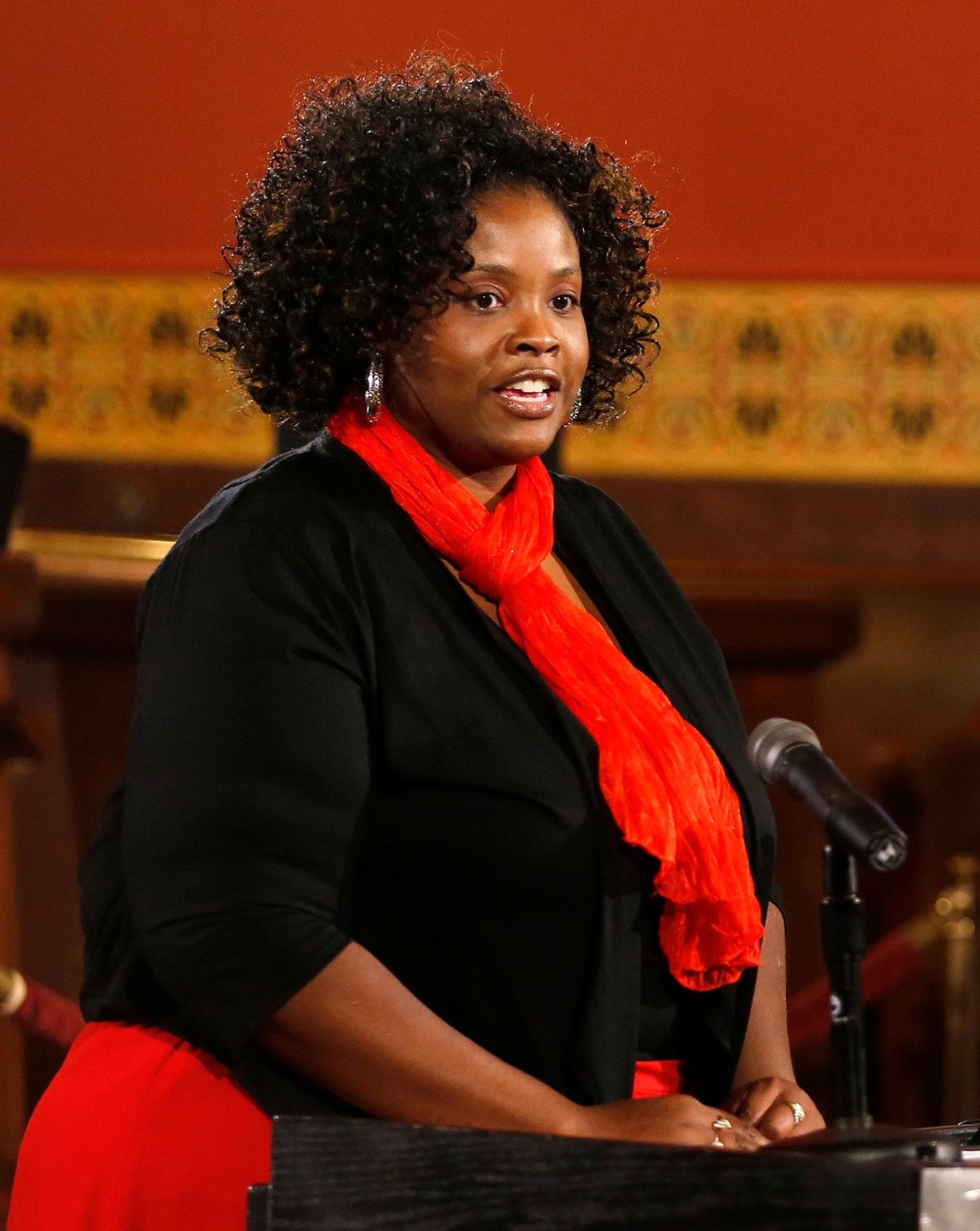 Tearicka Cradle, then the program director of the Restoration Academy program, speaks in 2014 during a graduation ceremony at City Hall.