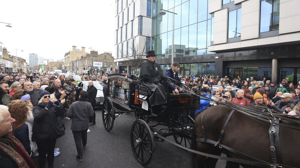 Crowds gathered in Dublin to pay tribute to Shane MacGowan. - Liam McBurney/AP