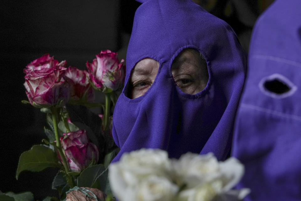 A penitent known as cucurucho takes part in the Jesus the Almighty Good Friday procession, as part of Holy Week celebrations, in Quito, Ecuador, Friday, March 29, 2024. Holy Week commemorates the last week of Jesus Christ’s earthly life which culminates with his crucifixion on Good Friday and his resurrection on Easter Sunday. (AP Photo/Dolores Ochoa)