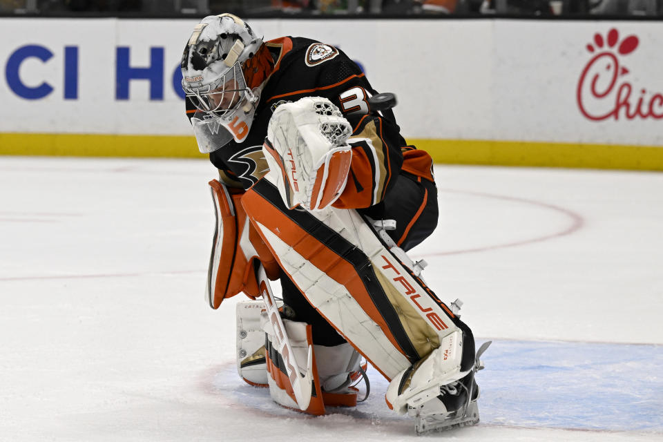 Anaheim Ducks goaltender John Gibson deflects a shot by the St. Louis Blues during the first period of an NHL hockey game in Anaheim, Calif., Sunday, Nov. 19, 2023. (AP Photo/Alex Gallardo)