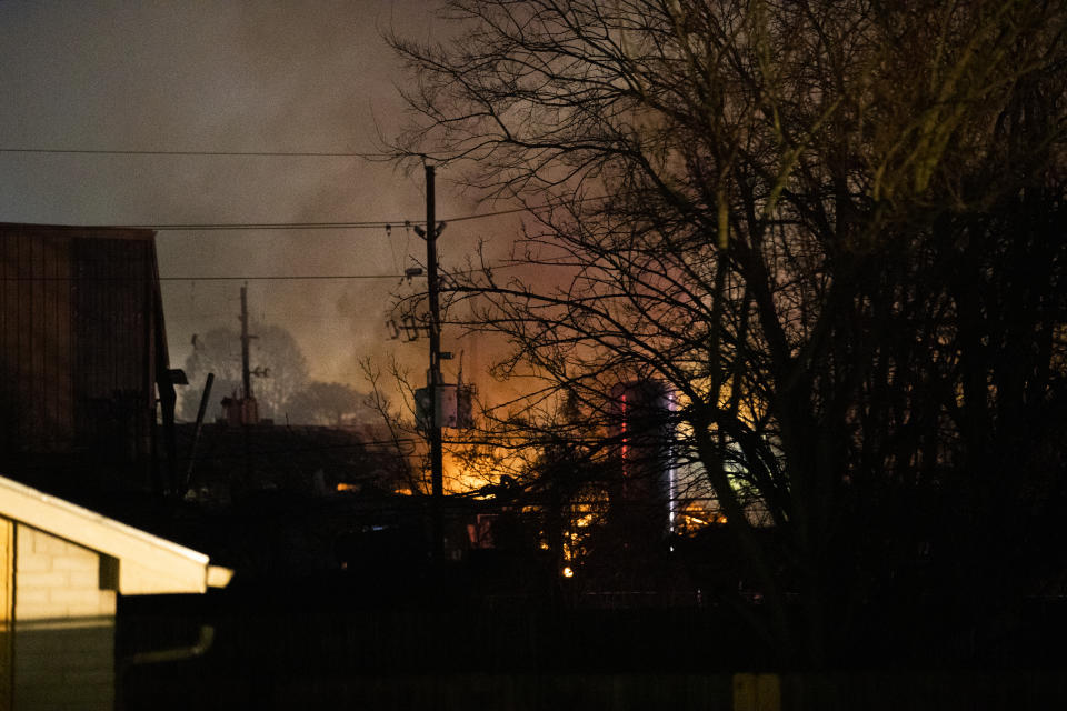 Flames fill the sky after a massive explosion rocks west Houston Friday, Jan. 24, 2020, in Houston. A massive explosion early Friday leveled a warehouse in Houston and damaged nearby buildings and homes, rousing frightened people from their sleep miles away. (Marie D. De Jesús/Houston Chronicle via AP)