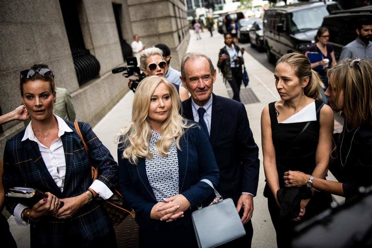 Image: Virginia Giuffre, center, one of Jeffrey Epstein's accusers at federal court in New York on Aug. 27, 2019.  (Mark Kauzlarich / Bloomberg via Getty Images)