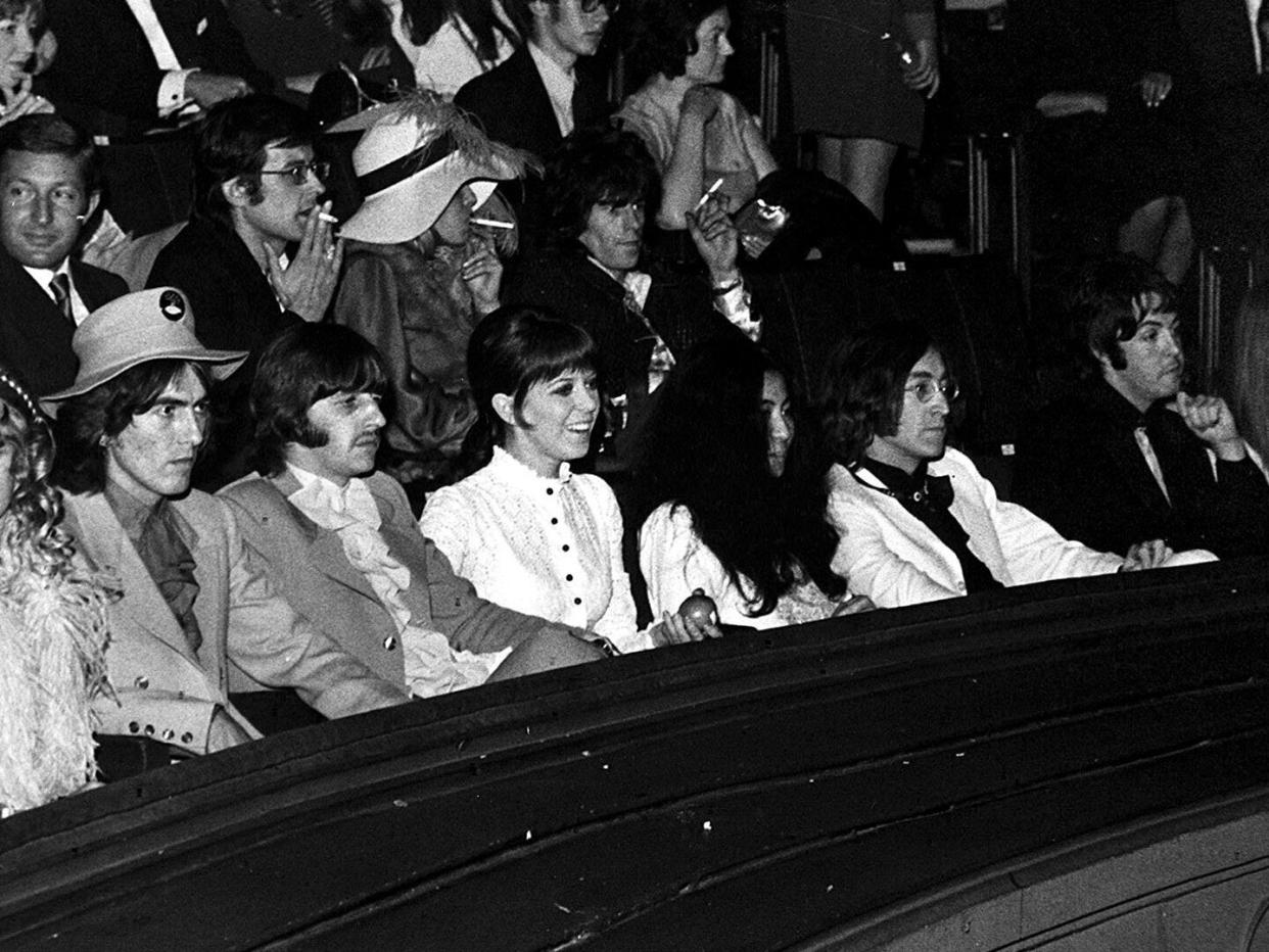 The writing on the wall: George Harrison, Ringo Starr and wife Maureen, Yoko Ono, John Lennon and Paul McCartney at the 1968 premiere of 'Yellow Submarine': Harry Myers/Rex