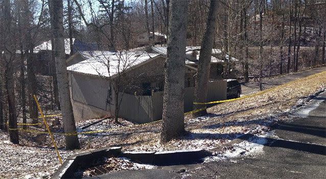 The Hendrix family home cordoned off with police tape after their bodies were found inside. Photo: AP.