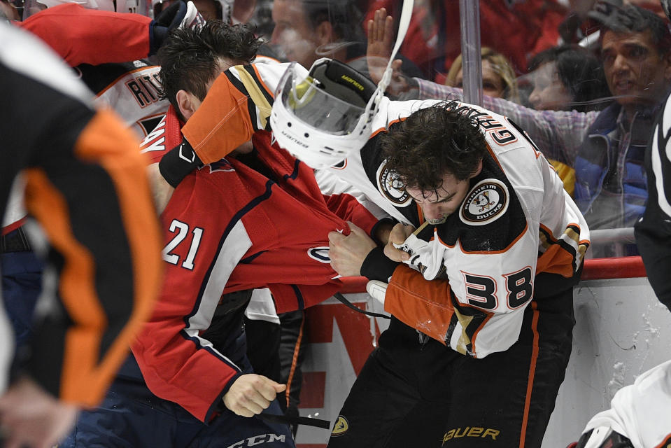 Washington Capitals right wing Garnet Hathaway (21) fights Anaheim Ducks center Derek Grant (38) during the second period of an NHL hockey game, Monday, Nov. 18, 2019, in Washington. (AP Photo/Nick Wass)