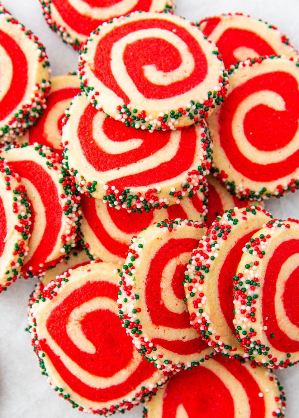 <p>These easy pinwheel cookies are beyond mesmerizing but also so easy to make. Make a batch of our easy <a href="https://www.delish.com/cooking/recipe-ideas/recipes/a50502/basic-sugar-cookies-recipe/" rel="nofollow noopener" target="_blank" data-ylk="slk:sugar cookie dough;elm:context_link;itc:0;sec:content-canvas" class="link ">sugar cookie dough</a>, then dye one half red. Then simply roll them together to create the swirl. The sprinkles are optional but they add so much extra fun!</p><p>Get the <strong><a href="https://www.delish.com/holiday-recipes/christmas/a30210803/christmas-pinwheel-cookies-recipe/" rel="nofollow noopener" target="_blank" data-ylk="slk:Christmas Pinwheel Cookies recipe;elm:context_link;itc:0;sec:content-canvas" class="link ">Christmas Pinwheel Cookies recipe</a></strong>.</p>