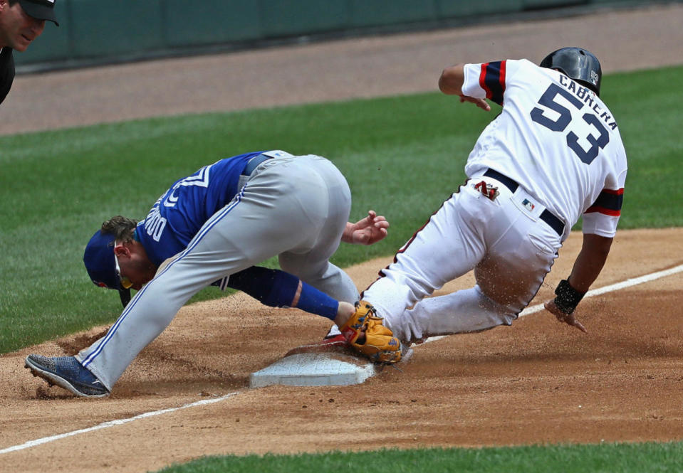 Melky Cabrera slides into third base in Chicago