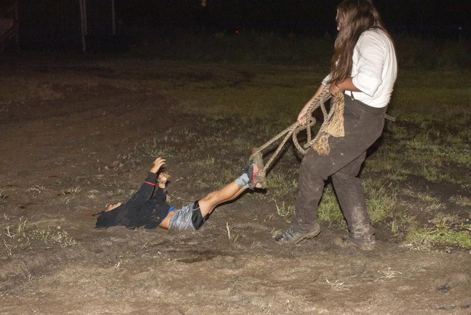 At Terror Town, a person is found guilty and dragged through the mud.