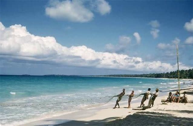 A 1956 photo released by the Jamaica Environment Trust shows fishermen pulling a net on the coast of Negril. Source: AP Photo