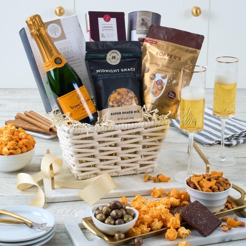 <p><a href="https://go.redirectingat.com?id=74968X1596630&url=https%3A%2F%2Fwww.gourmetgiftbaskets.com%2FMidnight-Snack-Veuve-Champagne-Basket.asp%3Fgad_source%3D1%26cid%3D17699989602%26gclid%3DCjwKCAjwh4-wBhB3EiwAeJsppC34rA2mu7-IgR88x6p9giYOKrzwwFvk9-cDrQjzdeCICOPOQ0qj0BoCVaYQAvD_BwE&sref=https%3A%2F%2Fwww.esquire.com%2Flifestyle%2Fg60323283%2Fbest-luxury-gift-baskets-for-women%2F" rel="nofollow noopener" target="_blank" data-ylk="slk:Shop Now;elm:context_link;itc:0;sec:content-canvas" class="link ">Shop Now</a></p><p>Midnight Snack Veuve Champagne Basket</p><p>gourmetgiftbaskets.com</p><p>$159.99</p>