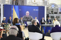 Denys Shmyhal, Ukraine's prime minister, is seen on a video screen during a G7 Finance Ministers Meeting at the federal guest house Petersberg, near Bonn, Germany, Thursday, May 19, 2022. (Federico Gambarini/DPA via AP, Pool)