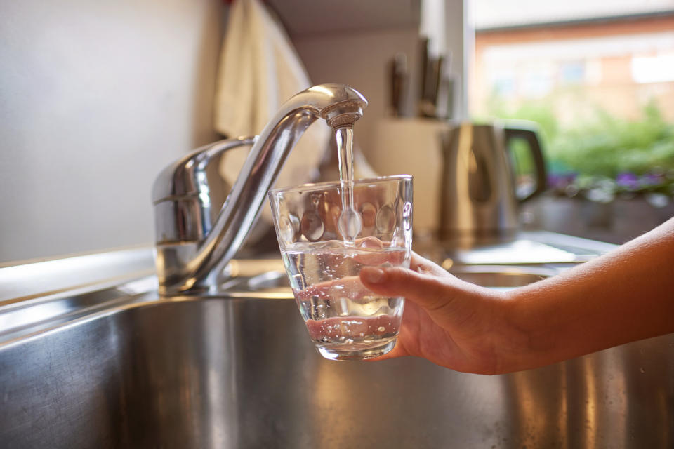 Drinking a glass of waters. (Getty Images)