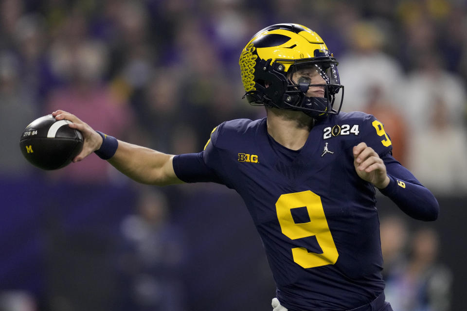 Michigan quarterback J.J. McCarthy passes against Washington during the first half of the national championship NCAA College Football Playoff game Monday, Jan. 8, 2024, in Houston. (AP Photo/Godofredo A. Vasquez)