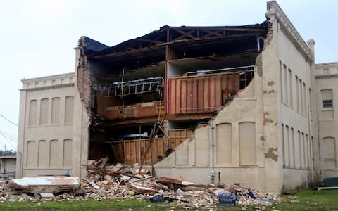 Debris lies on the ground after a building was destroyed by Hurricane Harvey in Aransas Pass - Credit: Gabe Hernandez