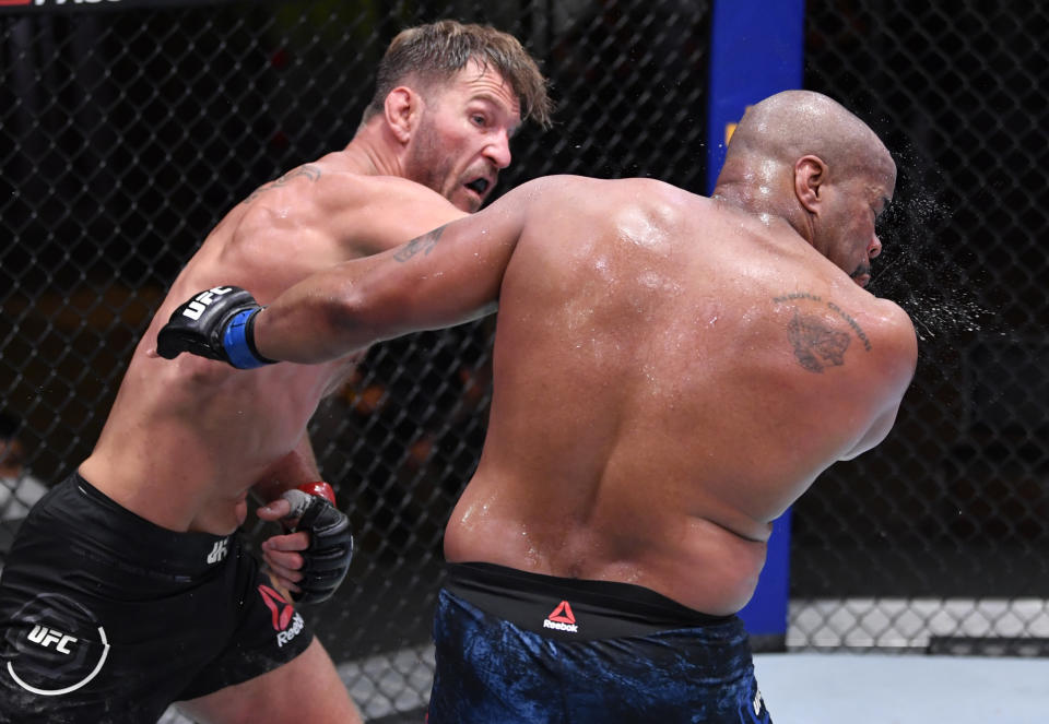 Stipe Miocic punches Daniel Cormier in their UFC heavyweight championship bout during UFC 252. (Photo by Jeff Bottari/Zuffa LLC)