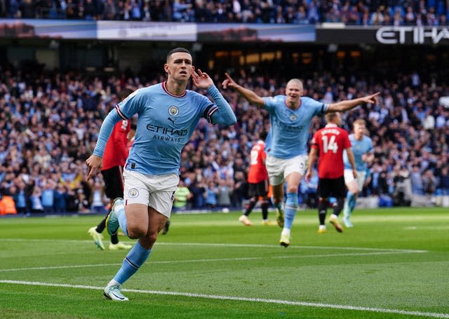 Phil Foden (left) celebrates scoring the opening goal 