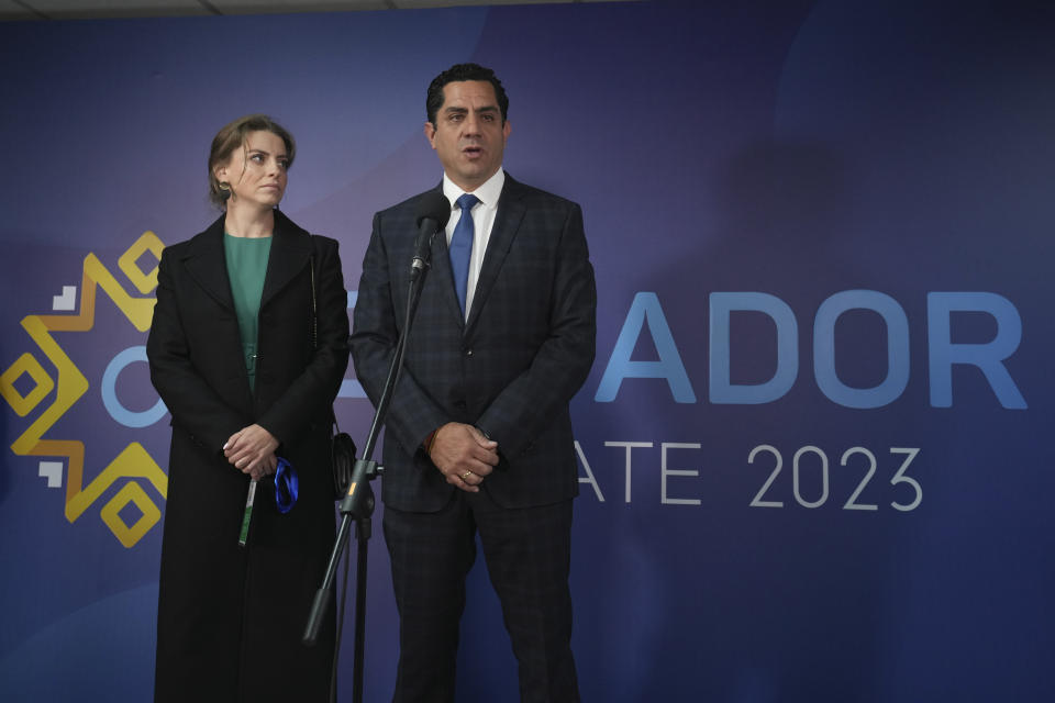 Xavier Hervas, presidential candidate for Total Renovation, standing next to his wife Anastasia Baeva, speaks prior to the presidential debate in Quito, Ecuador, Sunday, Aug. 13, 2023. Ecuador goes to the polls in a presidential election on Aug. 20. (AP Photo/Dolores Ochoa)