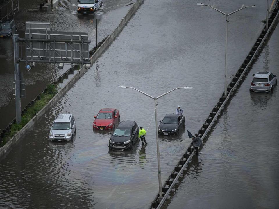 A general view shows cars stranded in floodwater on the FDR highway in Manhattan, New York on September 29, 2023.