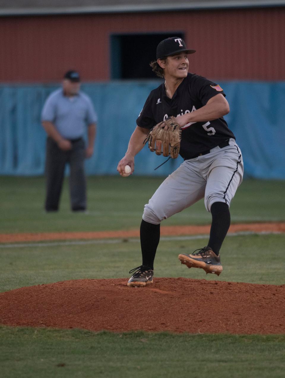 Tate pitcher Drew Reaves takes the hill to deliver the heat against Pace during Friday night's game at Pace. 