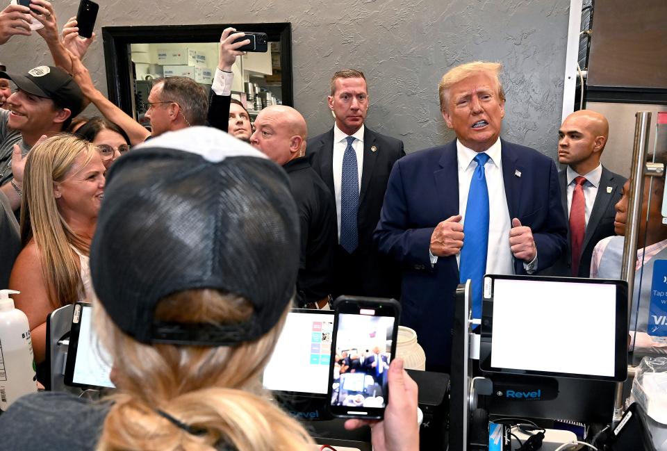 Former President Donald Trump stops by Downtown House of Pizza and places an order to go after speaking at the Lee County Republican dinner in Fort Myers last month.