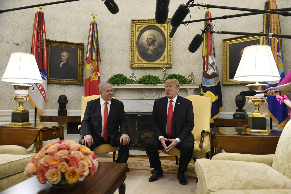 FILE - In this March 25, 2019, file photo, President Donald Trump, right, speaks as Israeli Prime Minister Benjamin Netanyahu, left, listens in the Oval Office of the White House in Washington at the beginning of their meeting. Netanyahu on Wednesday, Aug. 21, 2019, is steering clear of Trump’s comments questioning the loyalty of American Jews who support the Democratic Party, ignoring condemnation from Jewish critics who accuse him of voicing longstanding anti-Semitic tropes. (AP Photo/Susan Walsh, File)