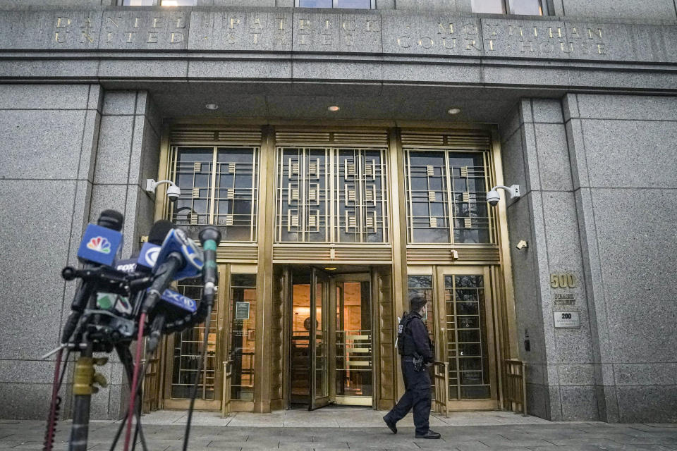 News microphones standby as a federal court officer patrols outside federal court, where a jury found Sayfullo Saipov guilty of killing eight people in 2017 with a speeding truck on a popular New York City bike path, Thursday Jan. 26, 2023, in New York. Saipov, a citizen of Uzbekistan, could face the death penalty on federal charges, an extreme rarity in New York state which no longer has capital punishment. (AP Photo/Bebeto Matthews)