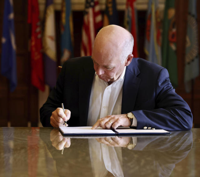 In this photo provided by the Montana Governor's Office, Republican Gov. Greg Gianforte signs a law banning TikTok in the state, Wednesday, May 17, 2023, in Helena, Mont. That law made Montana became the first state in the U.S. to completely ban TikTok. (Garrett Turner/Montana Governor's Office via AP)