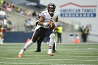 Chicago Bears quarterback Justin Fields looks to pass against the Seattle Seahawks during the first half of a preseason NFL football game, Thursday, Aug. 18, 2022, in Seattle. (AP Photo/Caean Couto)