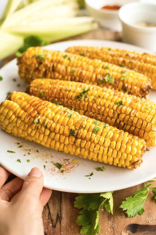 <p>Dish by Dish</p><p>This air fryer corn on the cob is simple and tasty, and means you can enjoy roasted corn anytime! A gluten-free and vegan side.</p><p><strong>Get the recipe: <a href="https://www.dishbydish.net/air-fryer-corn-on-the-cob/" rel="nofollow noopener" target="_blank" data-ylk="slk:Air Fryer Corn on the Cob;elm:context_link;itc:0;sec:content-canvas" class="link ">Air Fryer Corn on the Cob</a></strong></p><p><strong>Related: <a href="https://parade.com/974693/pipandebby/47-air-fryer-recipes-so-good-youll-want-to-toss-every-other-appliance-in-your-kitchen/" rel="nofollow noopener" target="_blank" data-ylk="slk:47 Air Fryer Recipes;elm:context_link;itc:0;sec:content-canvas" class="link ">47 Air Fryer Recipes</a></strong></p>