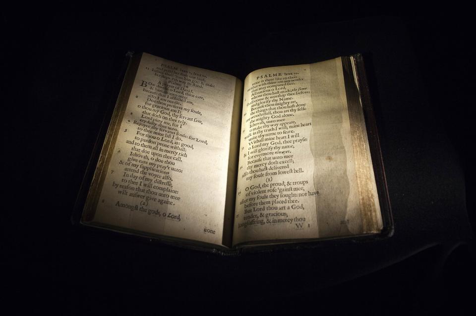 A copy of "The Bay Psalm Book" sits in a display case at Sotheby's Auction House in New York