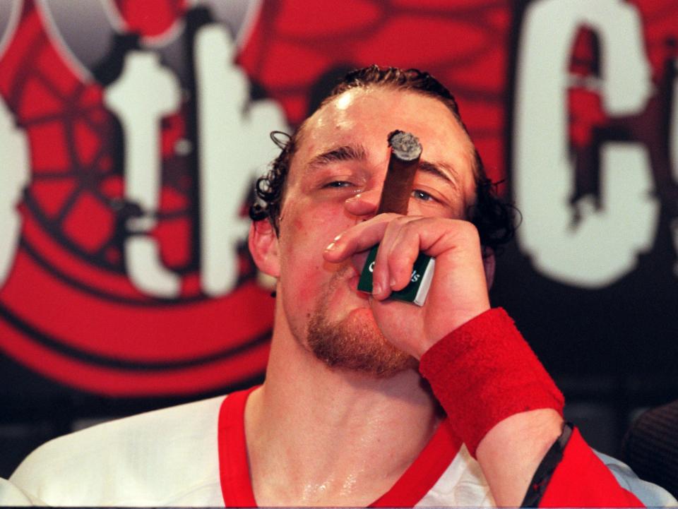 Darren McCarty enjoys the sweet taste of victory after the Detroit Red Wings' win in Game 4 of the Stanley Cup Finals, 2-1, to sweep the Philadelphia Flyers at Joe Louis Arena, June 7, 1997.