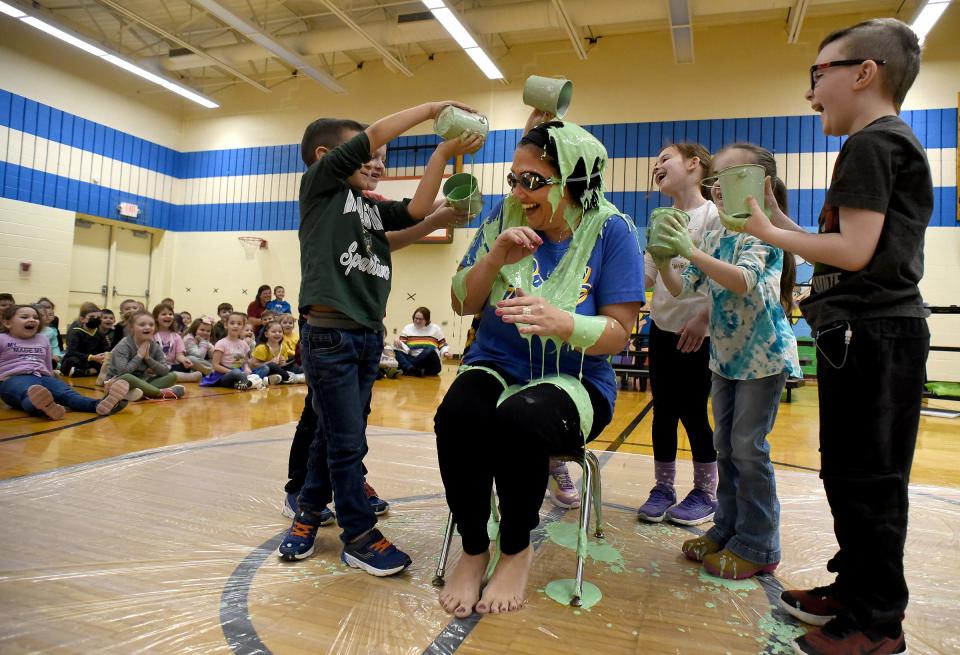 Joseph McLaughlin (left), a preschooler at Sodt Elementary and the runner-up top seller of the cookie dough fundraiser, with first grader Levi Blair; kindergartners Teagan Lancaster and Samara Bessey; first grader Weston Ingison; and another student not visible behind were the first students to dump slime onto principal Tara Roe.