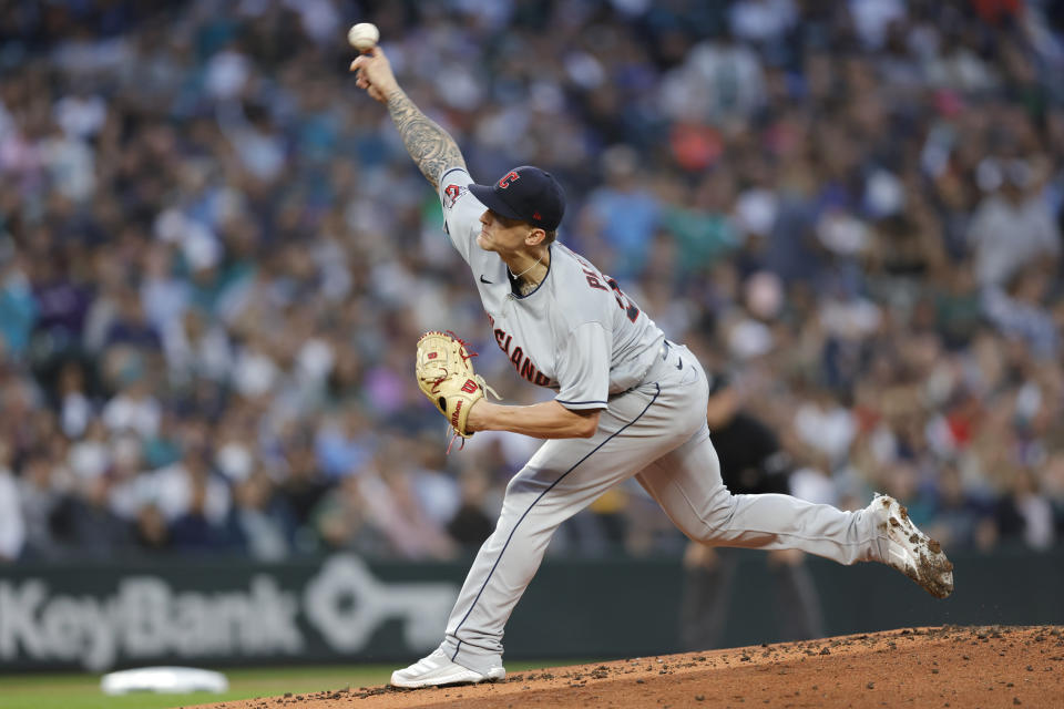 Cleveland Guardians starting pitcher Zach Plesac works against the Seattle Mariners during the first inning of a baseball game, Saturday, Aug. 27, 2022, in Seattle. (AP Photo/John Froschauer)