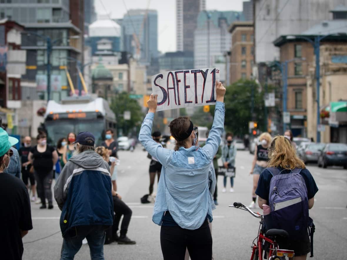 People gather at a Drug User Liberation Front rally in support of a safe supply of drugs in Vancouver on June 23, 2020. (Maggie MacPherson/CBC - image credit)