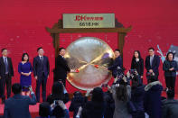 Xin Lijun, CEO of JD Health, center right, leads executives to sound the gong during a ceremony to mark the listing of the company stock on the Hong Kong Stock Exchange at the JD Headquarters in Beijing Tuesday, Dec. 8, 2020. Shares in China's biggest online health care platform rose 40% in their Hong Kong stock market debut Tuesday, reflecting investor enthusiasm for the fledgling industry as the country emerges from the coronavirus pandemic. (AP Photo/Ng Han Guan)