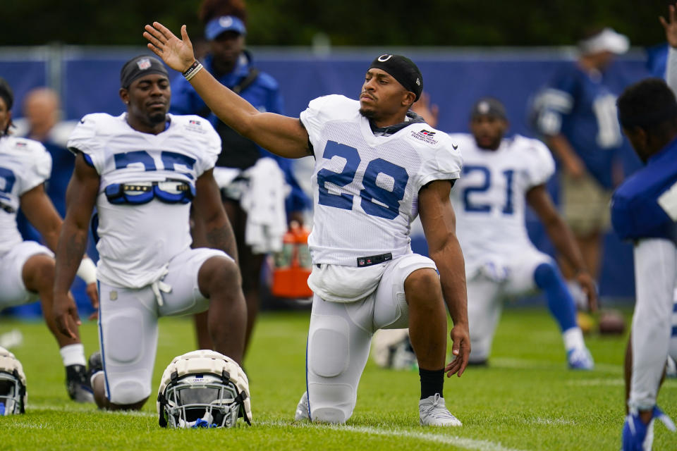 Indianapolis Colts running back Jonathan Taylor (28) warms up during practice at the NFL team's football training camp in Westfield, Ind., Thursday, Aug. 4, 2022. (AP Photo/Michael Conroy)