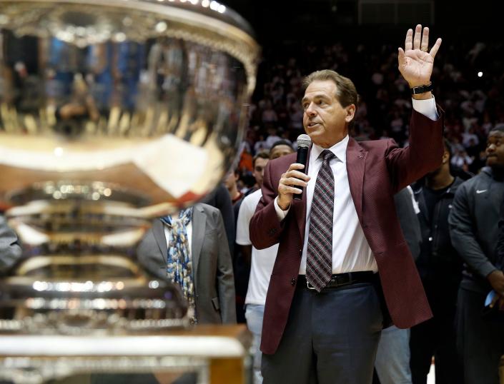 Alabama coach Nick Saban and his players from the team were on hand to accept the Iron Bowl Trophy during half-time of the Alabama Auburn basketball game at Coleman Coliseum in Tuscaloosa, Ala. on Saturday Jan. 24, 2015. staff photo | Robert Sutton