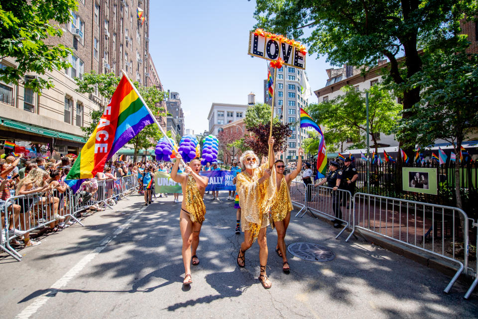 NEW YORK, NEW YORK - JUNE 26: People in pride colors attend and march in front of the Stonewall Inn during the 2022 New York City Pride March on June 26, 2022 in New York City. (Photo by Roy Rochlin/Getty Images)