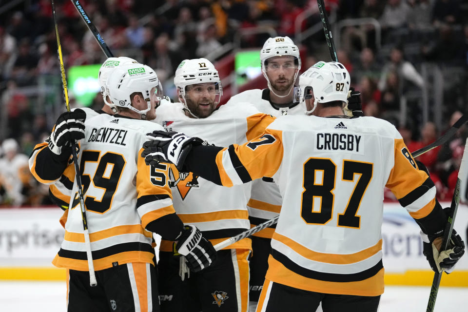 Pittsburgh Penguins right wing Bryan Rust (17) celebrates his goal against the Detroit Red Wings in the third period of an NHL hockey game Wednesday, Oct. 18, 2023, in Detroit. (AP Photo/Paul Sancya)