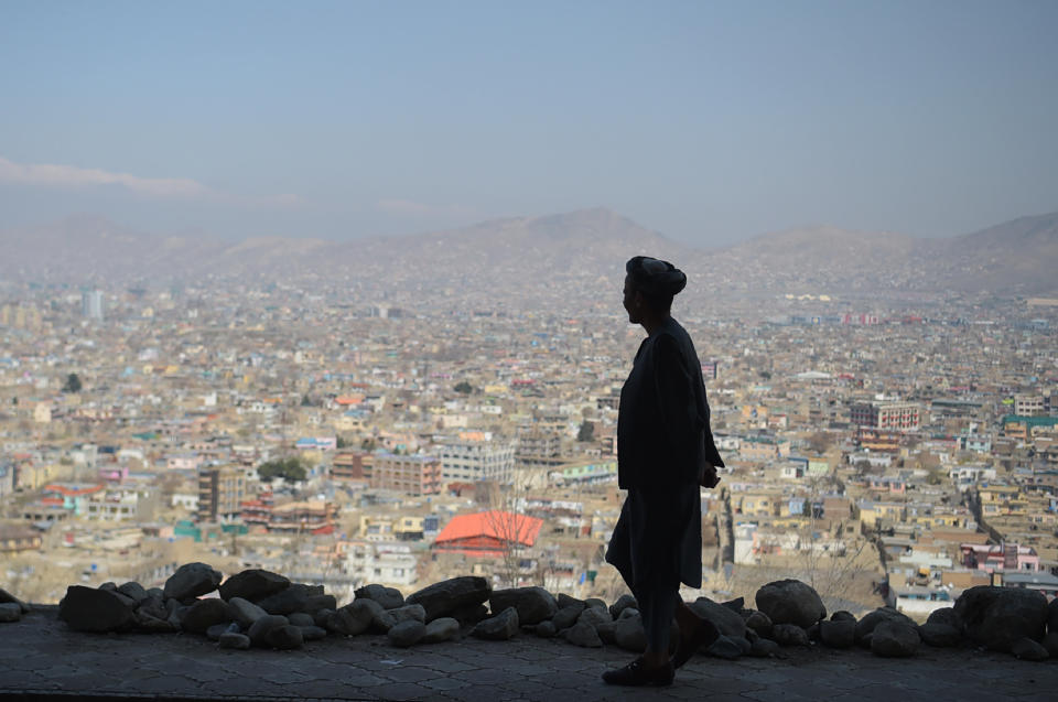 A man walks on a hillside path overlooking Kabul on March 21, 2018, the first day of Nowruz, or Persian New Year,&nbsp;